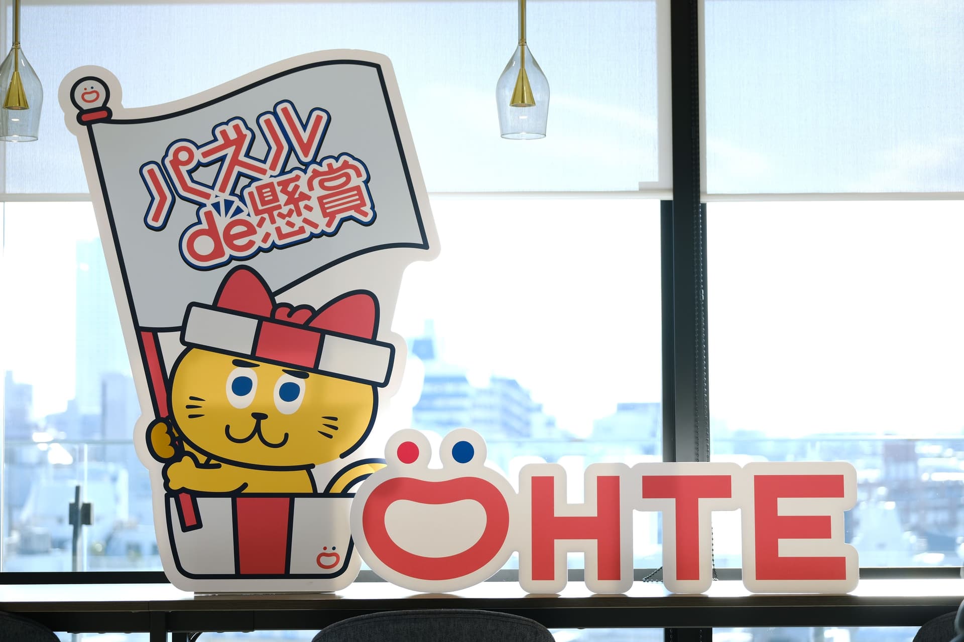 a cartoon cat is holding a flag in front of a window .