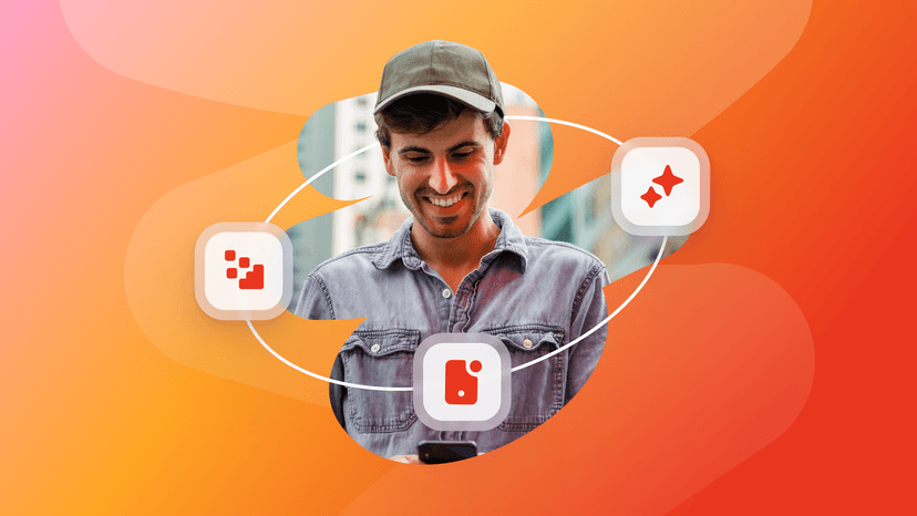 A smiling man looks at his phone, encircled by three red icons: data blocks, a tag, and two sparkles.