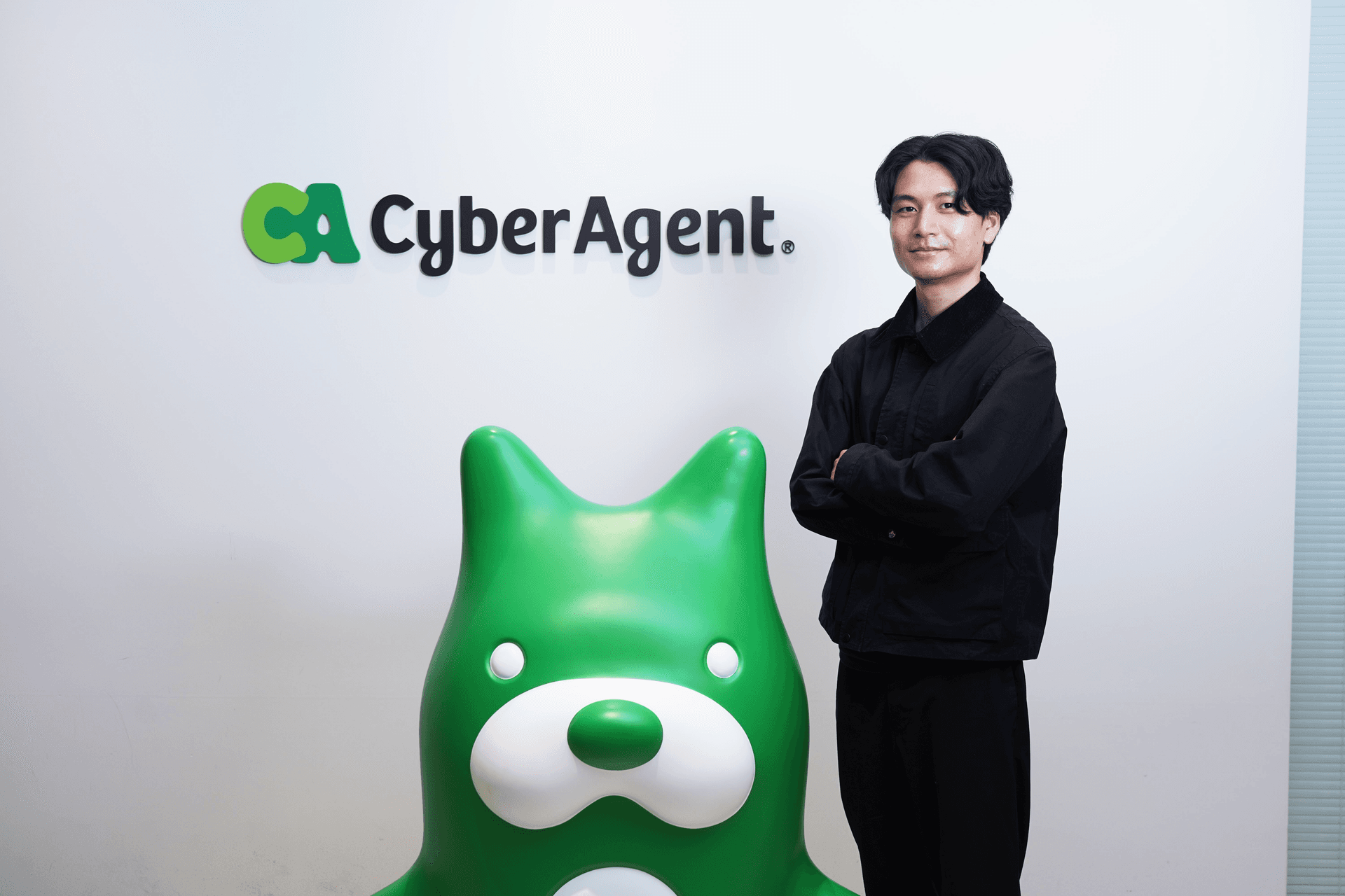 a man stands in front of a sign that says cyber agent