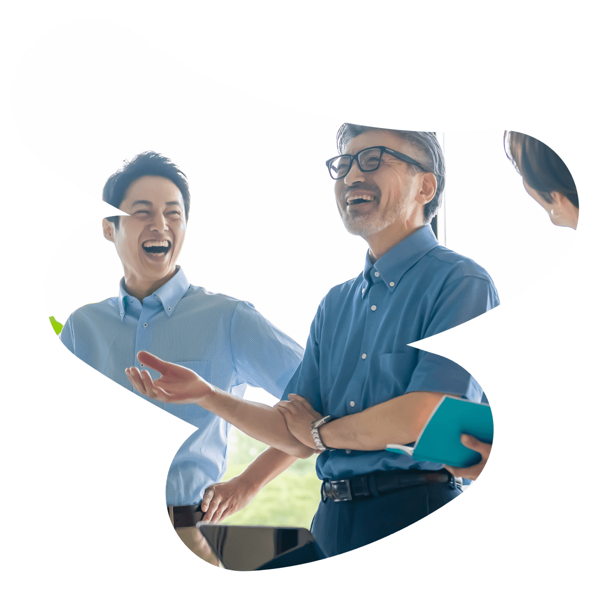 Two men laughing during a conversation.