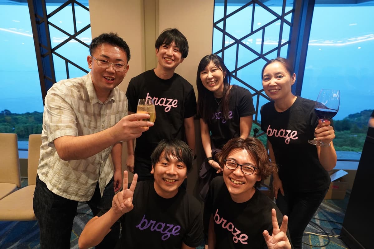 a group of people are posing for a picture in a room .