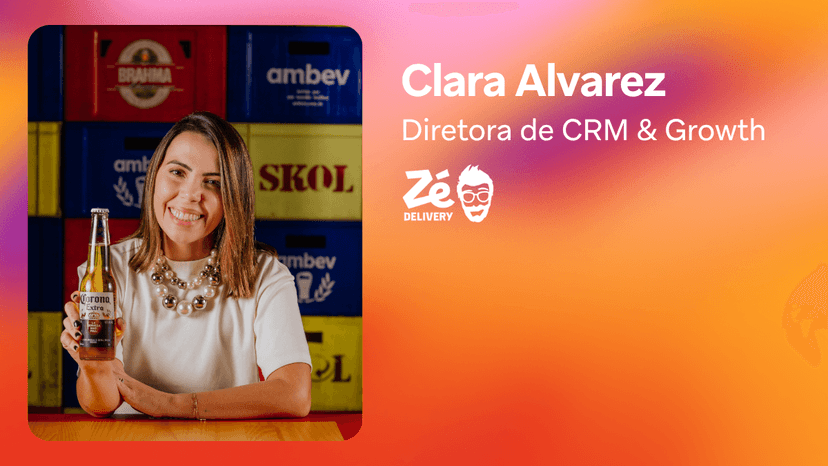 Clara Alvarez, Diretora de CRM & Growth for Zé Delivery, smiles while holding a Corona beer bottle.