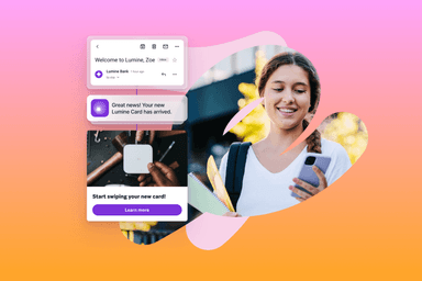 a woman is smiling while holding a cell phone and looking at a screen that says great news your new lumine card has arrived