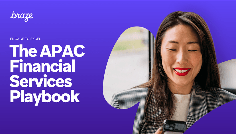 a woman is holding a cell phone in her hand and smiling .