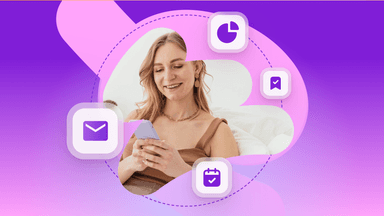 a woman is sitting on a couch looking at her phone