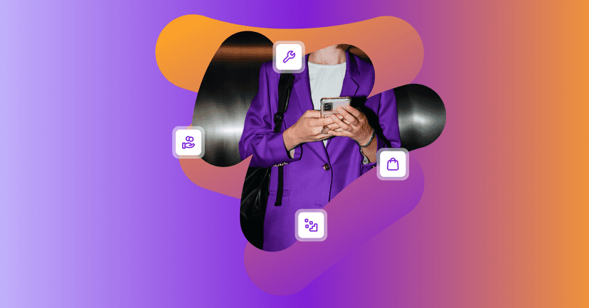 보라색 재킷을 입은 한 여성이 휴대폰을 사용하고 있다.