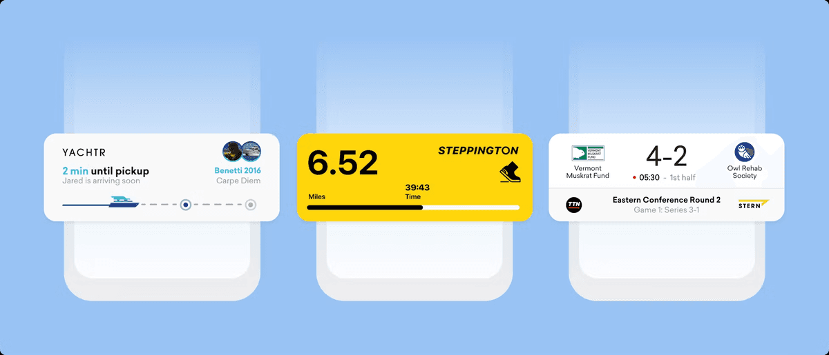 a phone screen shows a yacht and a stepping tom