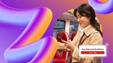 a woman sitting on a bus looking at her phone with a message that says your order is out for delivery