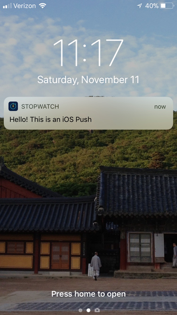 Push message example from Stopwatch on an iPhone home screen that reads: "Hello! This is an iOS Push".