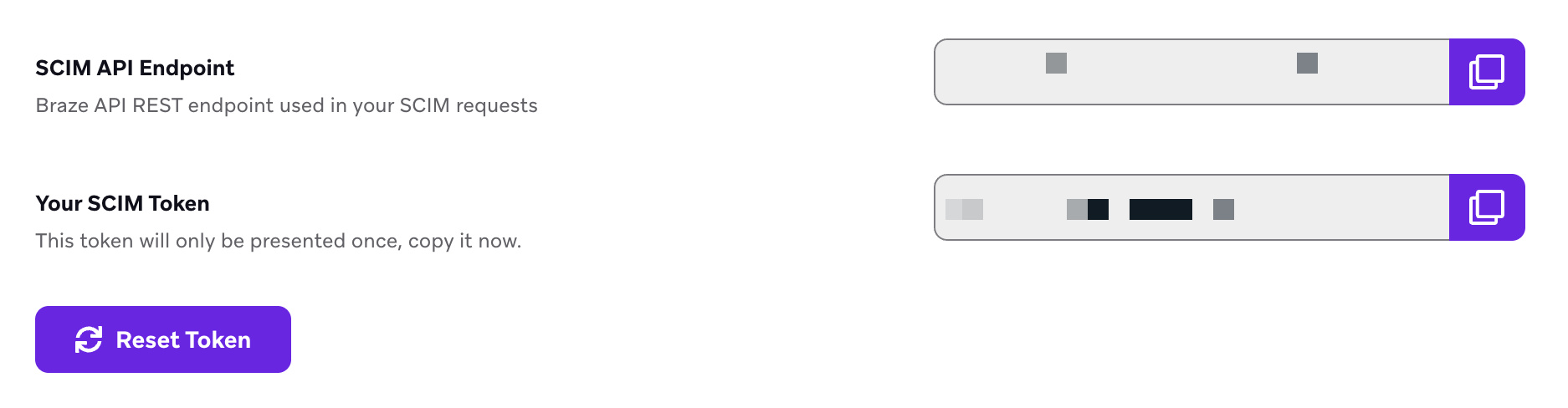 SCIM API Endpoint and SCIM Token fields displayed with masked values and copy buttons. Below the token field is a “Reset Token” button.