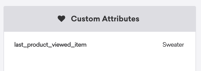 La sección de atributos personalizados dentro de un perfil de usuario lista "last_product_viewed_item" como "Sweater".